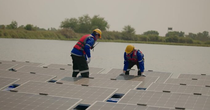 Technicians check floating solar farm wiring, polarity, and grounding for reliability and safety
