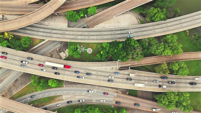 Vertical aerial view of Houston Texas freeway interchange with traffic and trees