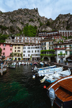 Scenic landscape of Limone sul Garda village, Lake Garda, Italy. Picturesque colorful houses and a peaceful harbor surrounded by blue waters and majestic alpine mountains. - Limone sul Garda, may 2026