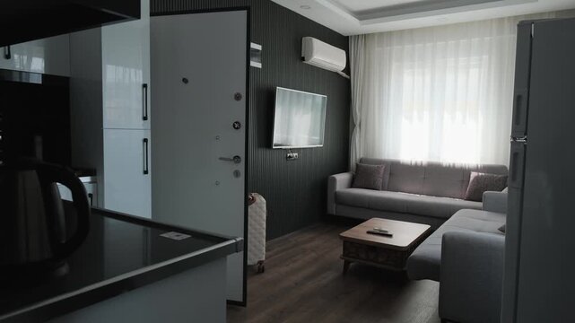Traveler arriving at modern furnished apartment with luggage, entering temporary rental accommodation for short stay, digital nomad and remote lifestyle concept