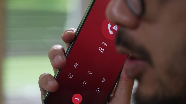 Man calling emergency number 112 for crisis situation