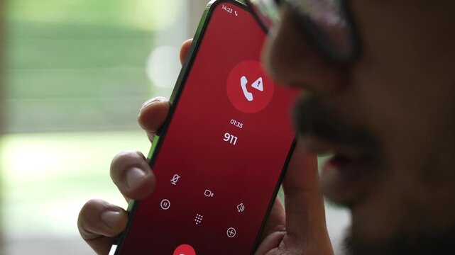 Man calling emergency number 911 for crisis situation