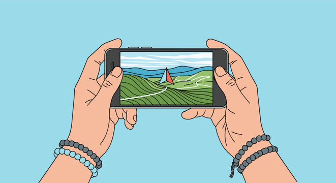Hands holding mobile phone in horizontal view showing a mountain landscape with navigation pointer for travel app.