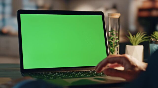 Laptop Green Screen Mockup on Desk at Night
