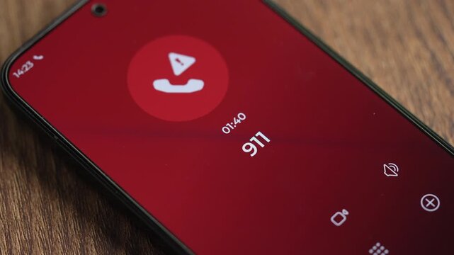 Close-up smartphone showing Emergency calling number 911 on the screen