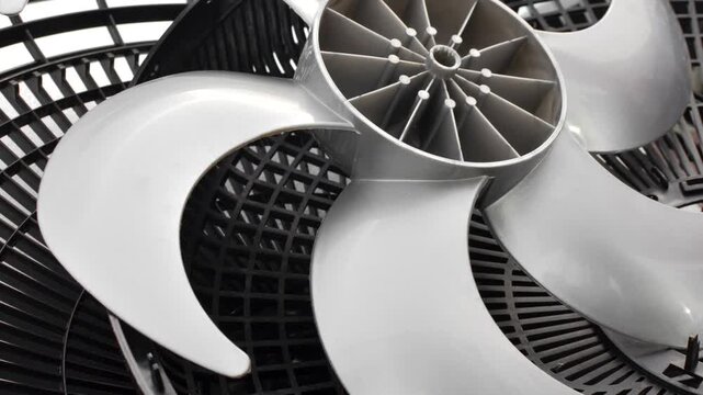 New fan impeller, disassembled into a technical composition, ready for assembly and use. Meticulous detail of newly manufactured fan impeller, disassembled for inspection and assembly.