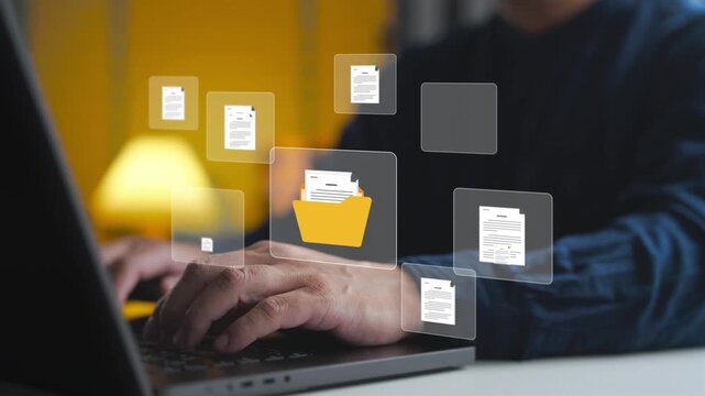 Document control specialist organizing digital files with folder interface on laptop. Concept of document management system, cloud database storage, corporate archiving, and paperless office workflow.