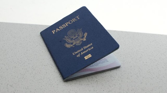 American Passport and Dollars: Fascinating detail of the US passport with dollar bills, symbolizing travel, exchange and money.