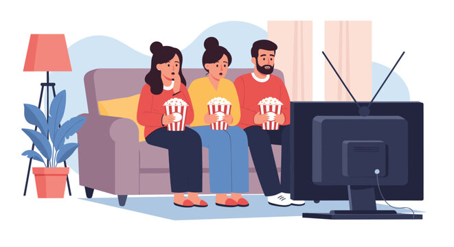 Family of three sitting together on a comfortable sofa and watching a movie on television while eating popcorn.