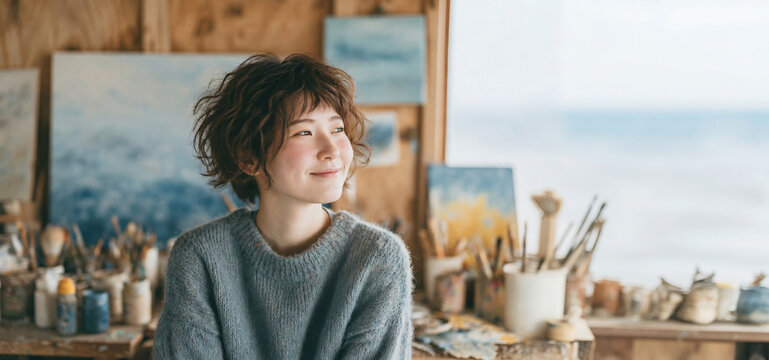 若いアーティストの希望と成長を感じさせる爽やかなポートレート