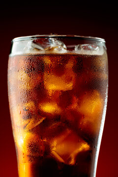 Fizz sparkling cola bubbly soda pop with ice cubes.