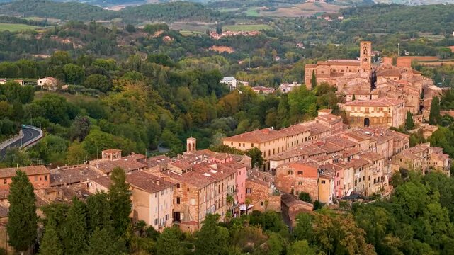 Italy Tuscany Colle Val d Elsa aerial 4K drone flight along hilltop borgo sunset cinematic overflight among rolling hills historic tuscan medieval town landscape