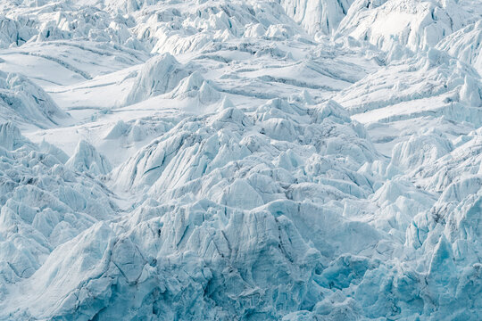 View of the jagged ice formations and deep crevasses of the Lilliehookbreen glacier in Svalbard, Svalbard and Jan Mayen.