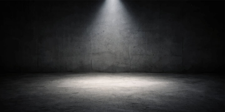 Dramatic single spotlight shining on dark concrete wall with illuminated floor, creating moody atmosphere for theatrical, concert, and performance settings