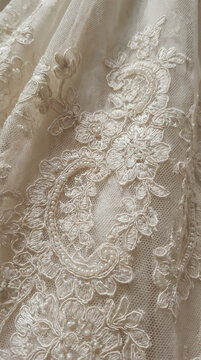 Intricate lace detail on elegant wedding dress fabric  
