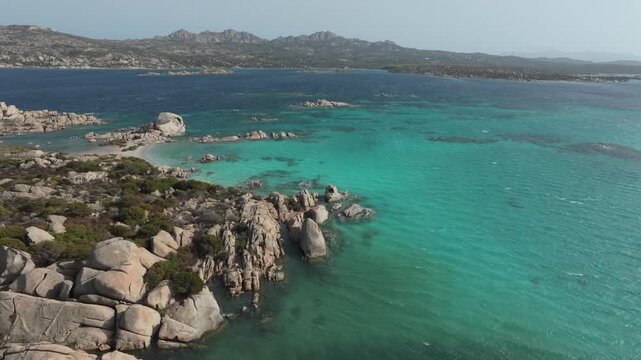 Stunning aerial view of the rocky coastline and turquoise sea of the La Maddalena archipelago in Sardinia, Italy. Idyllic summer holiday destination