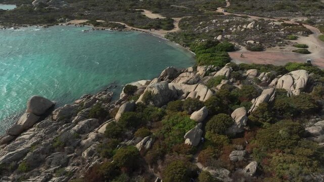 Scenic aerial view of the rocky coast and turquoise sea of La Maddalena National Park in Sardinia, Italy. Idyllic cove with clear water