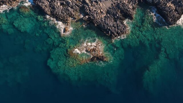 Crete Island coastline in the Mediterranean sea, drone aerial video on a sunny day in May
