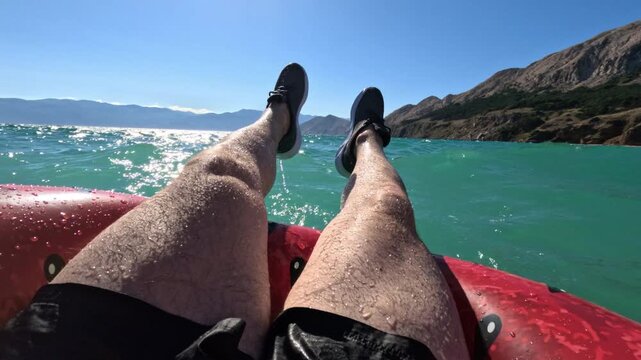 Relaxing on an inflatable tube over turquoise water