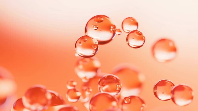 Floating Orange Bubbles In Gentle Motion. Closeup Of Shimmering Liquid Bubbles Over Warm Background
