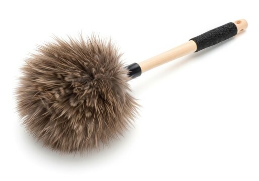 A dusting brush with accumulated dust and small debris on its bristles