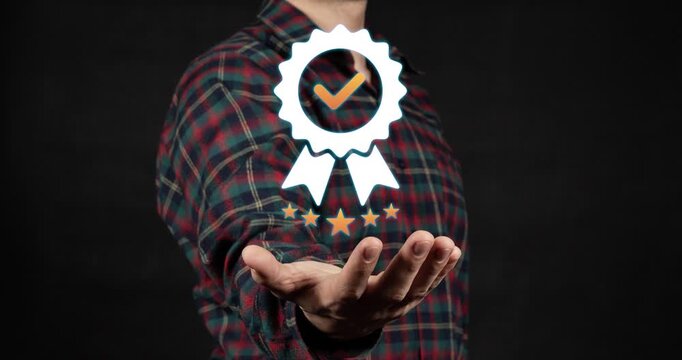 Motion graphics of a modern businessman hand holding a corporate quality warranty five star excellence seal with a black background