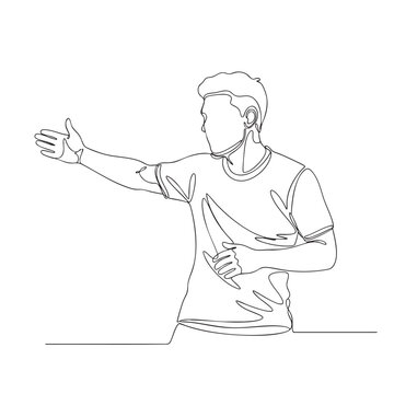 Soccer coach gesturing to players on field instructing team during match game sideline.
