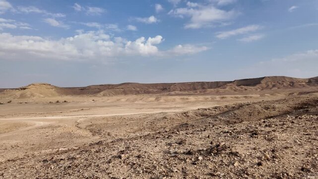 Tuwaiq mountain cliffs forming the dramatic Edge of the World escarpment, a striking desert landscape showcasing vastness and geological grandeur under a clear sky in Riyadh, Saudi Arabia
