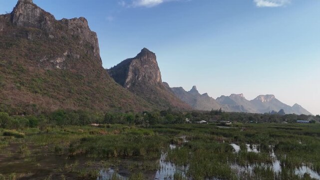 Aerial Drone View Of Bueng Bua Wetlands Thailand
Aerial drone footage of Bueng Bua Wood Boardwalk wetlands and limestone mountains in Thailand on 19 May 2026.
