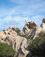 Fototapeta premium Rock formations along the coast of Sardinia provide a unique landscape for hiking and exploration near the sea