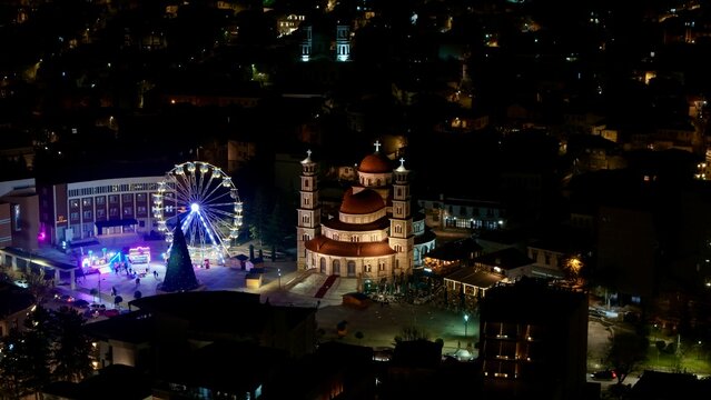 Silent Nights in Kor&ccedil;a Square
The main square feels calm and cinematic, with soft lights reflecting off the pavement and people fading into silhouettes.