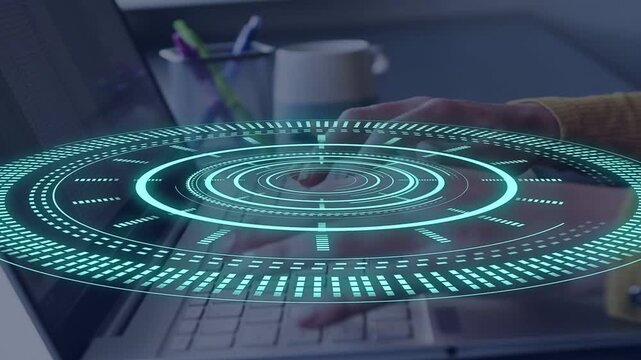 Woman typing on laptop, placing fingers initiating HUD for technology use, cyan rings tracking keys