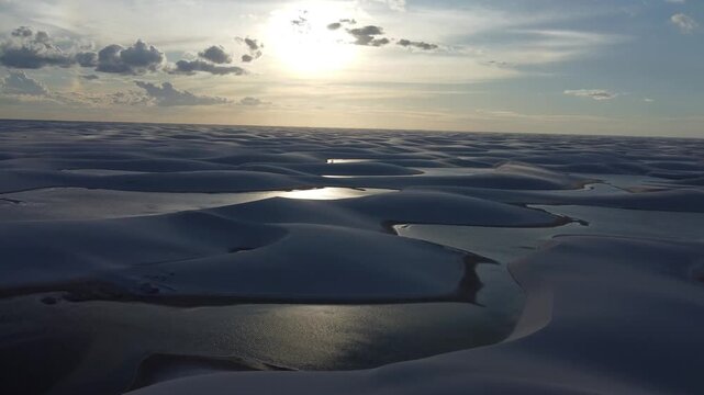 Lencois Maranhenses National Park &ndash; Cinematic view of quad bikes crossing dunes