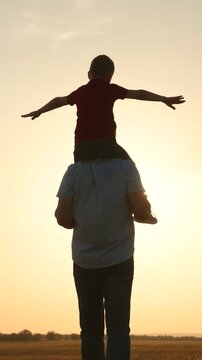 silhouette father carrying child boy his shoulders sunsethappy family, father carrying child, child on shoulders, sunset family time, parent child bonding, outdoor family fun, silhouette father son