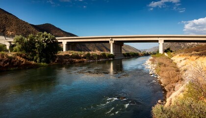 Fototapeta premium The San Gabriel River Flowing Under The 210 Freeway Near Azusa In Los Angeles County California
