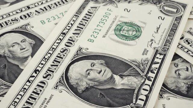 Close up macro shot of United States one dollar bills scattered