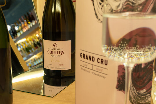Champagne Collery Grand Cru Rose bottle with a sparkling wine glass and mirror reflection. Luxury pink French alcohol product photography. Ukraine, Zhytomyr, May 06, 2026