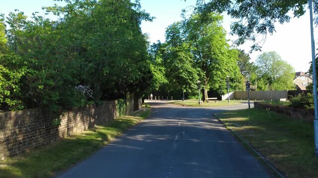 Drone shot flying forwards along Routh Lane in Tilehurst, Reading, UK
