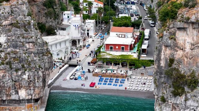 Aerial 4K drone video footage with panorama of Marina di Praia and Praiano coastline, scenic Amalfi Coast landscape with Mediterranean seaside views in Italy