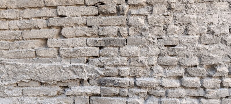 Aged cement limestone brick wall, horizontal textured background