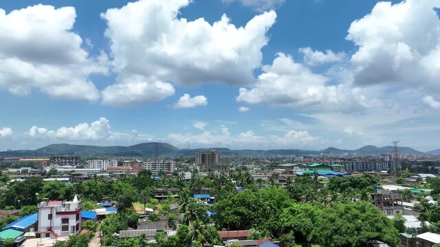 A drone footage of the city of Guwahati Assam india  surrounded by mountains from the foothills 4k 