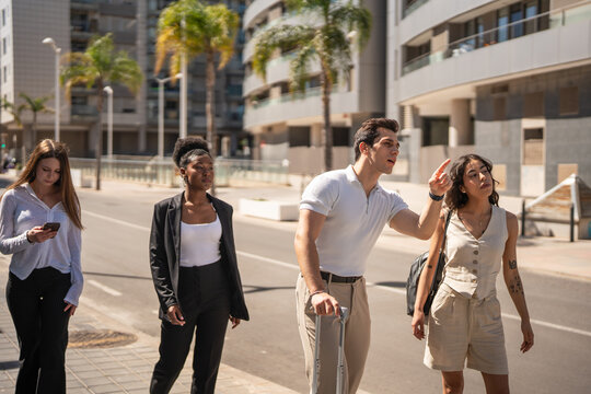 Group of tourists navigating city street asking for directions