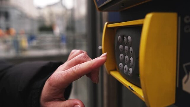 Woman Entering Door Code On Keypad In A Close-Up Shot