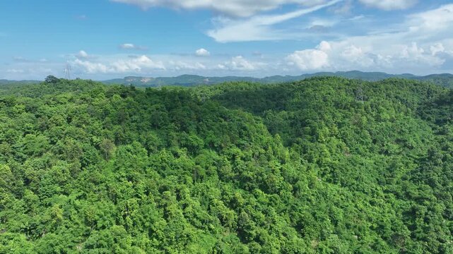 .An aerial view of the Gar Bahanga Forest Reserve reveals Guwahati city, Assam india  a captivating ecosystem where people are immersed in a verdant, forested landscape. 4k 