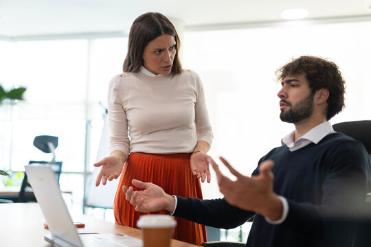 Colleagues having a conflict and argument in office