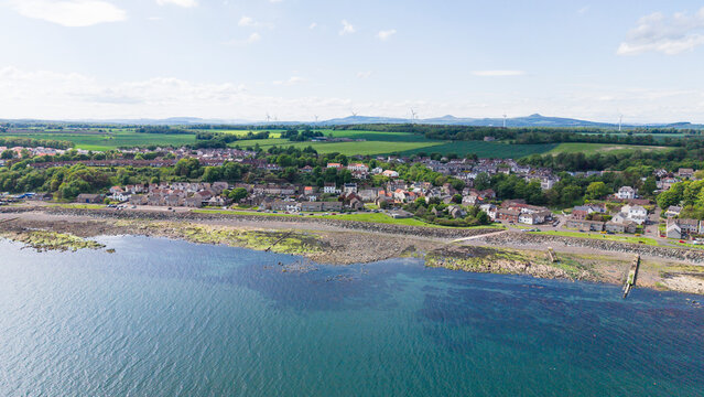 Scenic aerial view of the coastal village of East Wemyss and the rocky shore in Fife, Scotland.