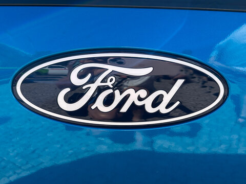 Ford company logo on the hood of a blue car. Close-up. Funchal. Portugal.