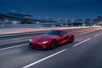 Fototapeta premium Red sports car speeding on highway at night with motion
