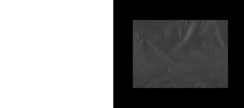 Crumpled black plastic texture background, wrinkled dark synthetic film surface, industrial polyethylene material with creases and highlights