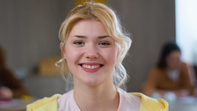Female teenager happy Caucasian girl student smiling at camera in high school university education study toothy smile cheerful glad positive face teen woman schoolgirl studying learning college class